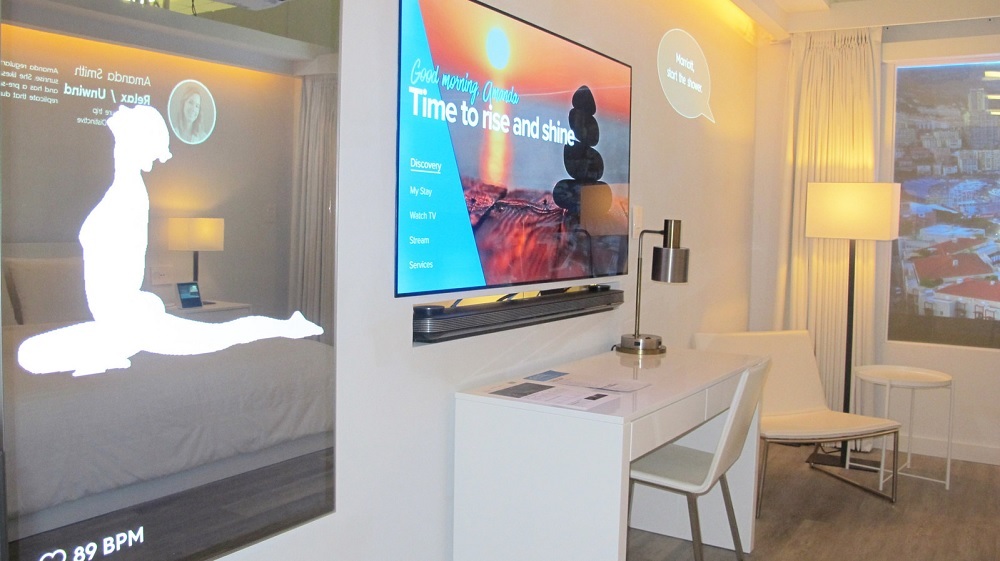 AI-driven smart hotel room with voice-enabled interactive digital interfaces
